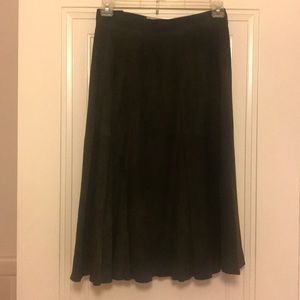 Forest-green suede skirt.